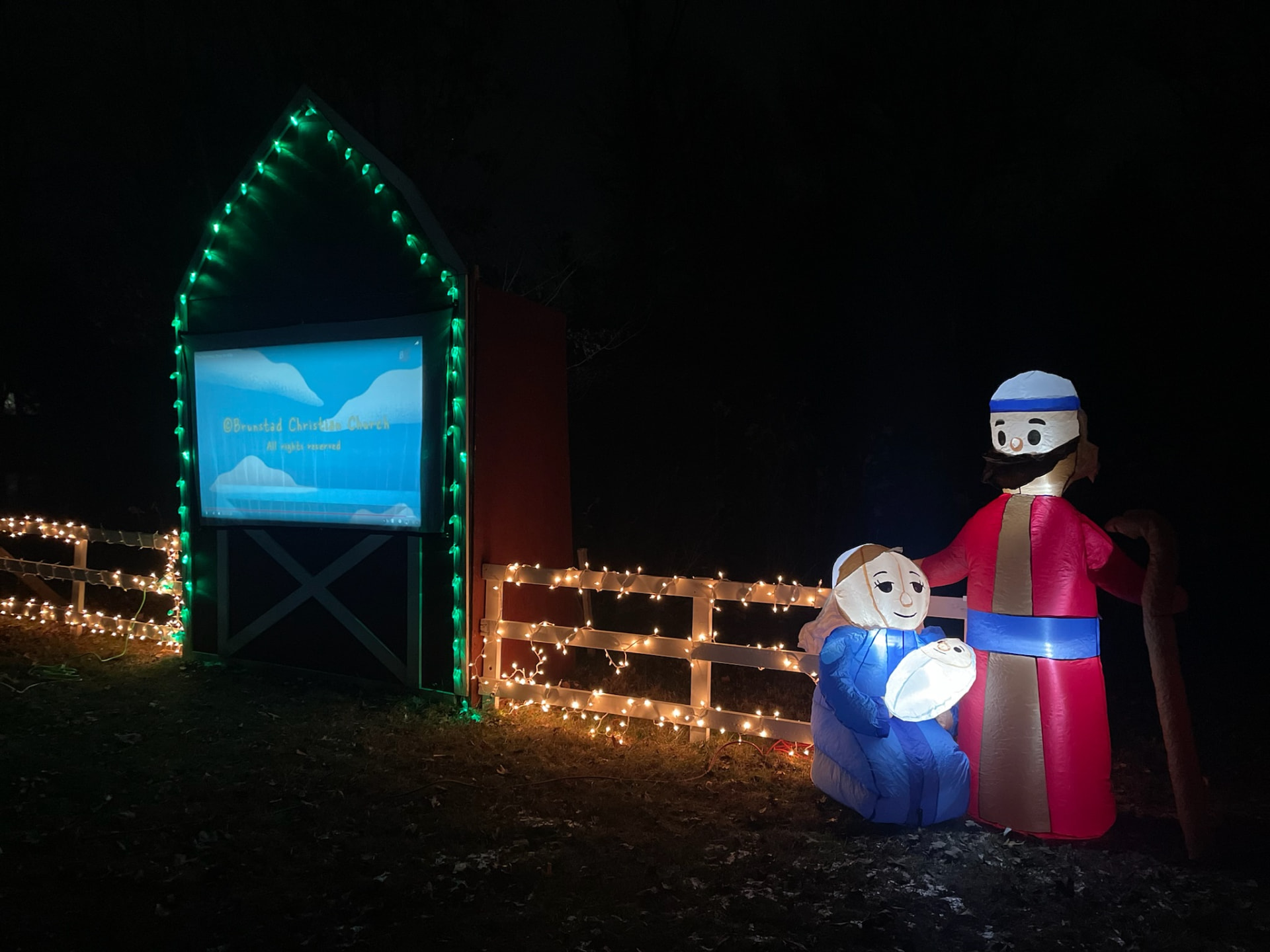 Illuminated nativity scene with Mary, Joseph, and baby Jesus