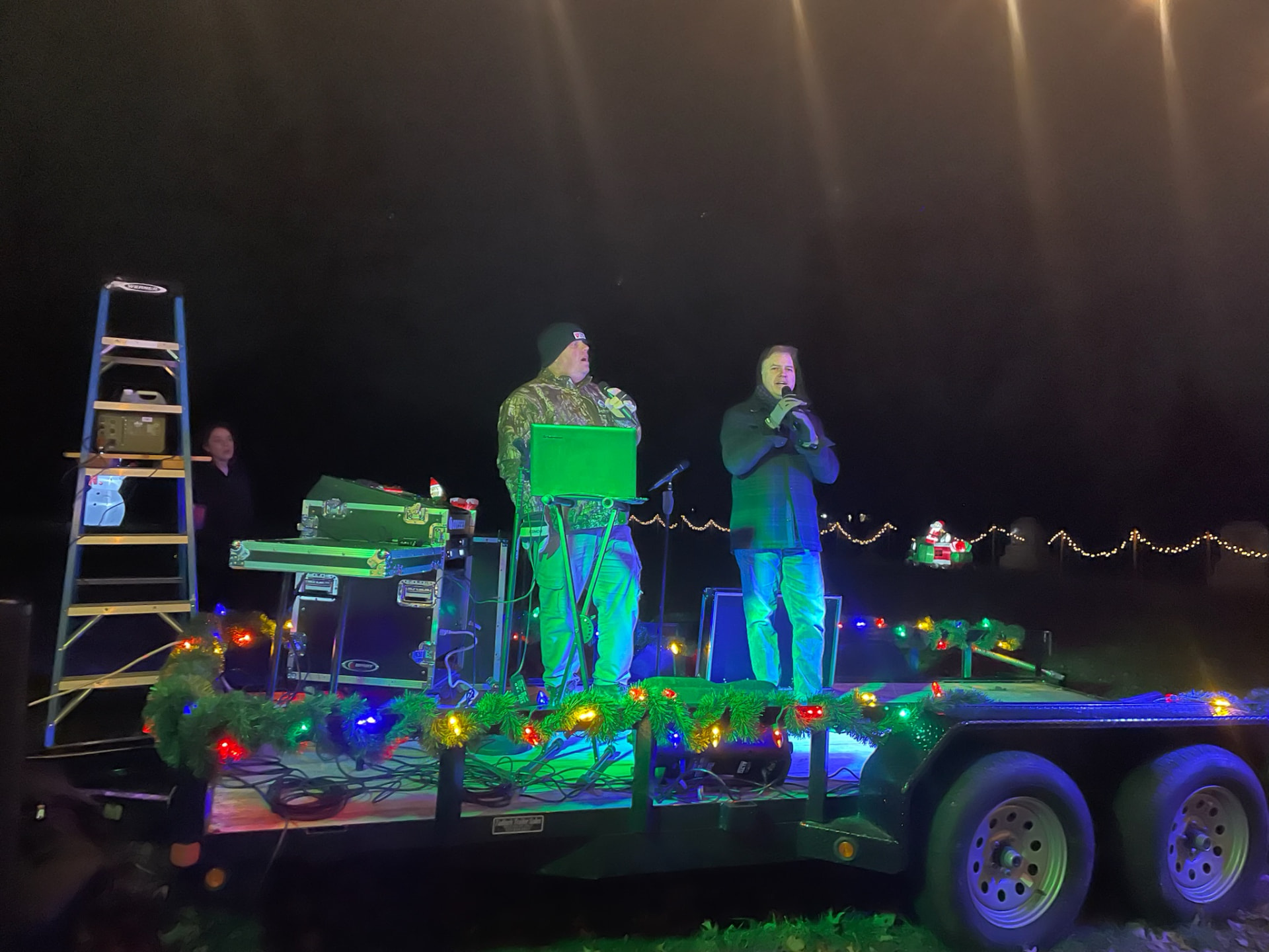 Live Christmas music performed from a decorated trailer stage