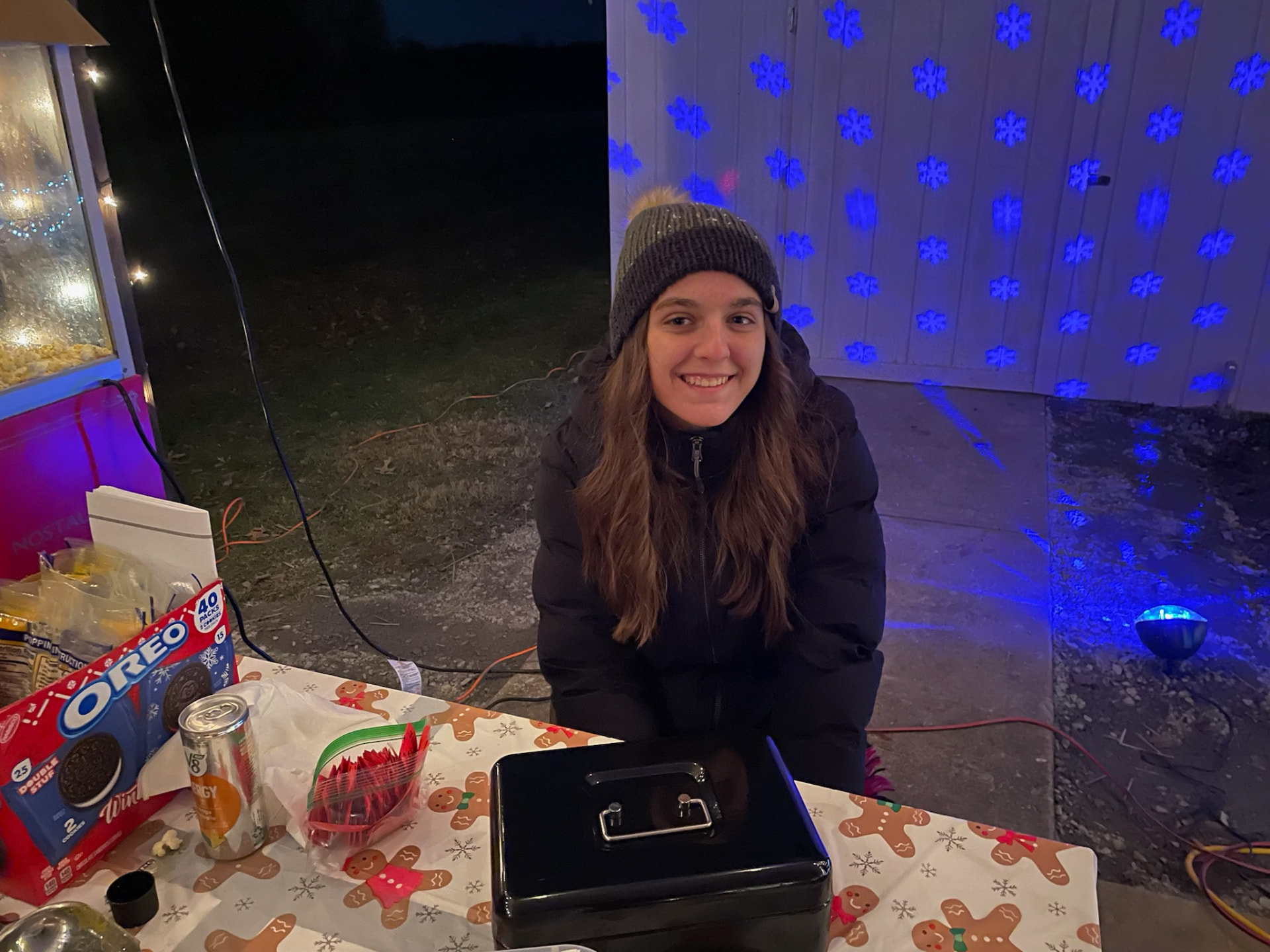 Volunteer serving snacks at the popcorn stand