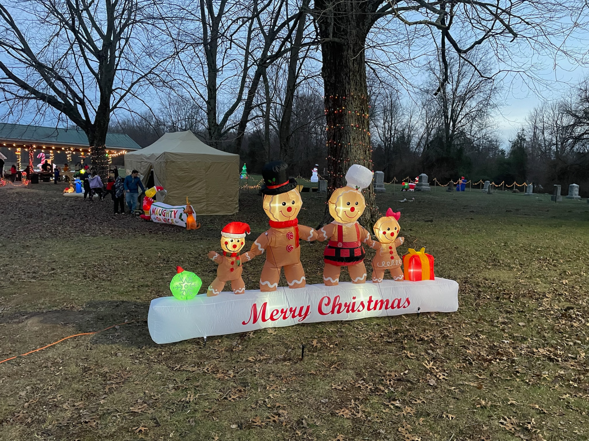 Giant inflatable gingerbread family wishing everyone a Merry Christmas
