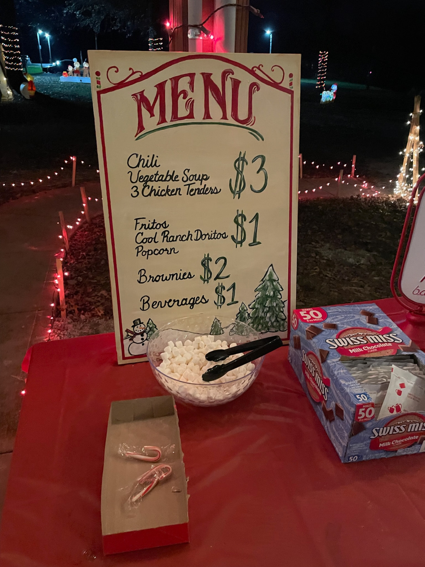 Hand-painted menu board with hot cocoa and treats